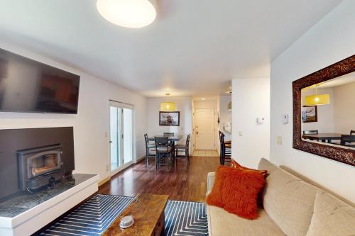 a living room with a couch and a fireplace at Alpine Escape in Edwards