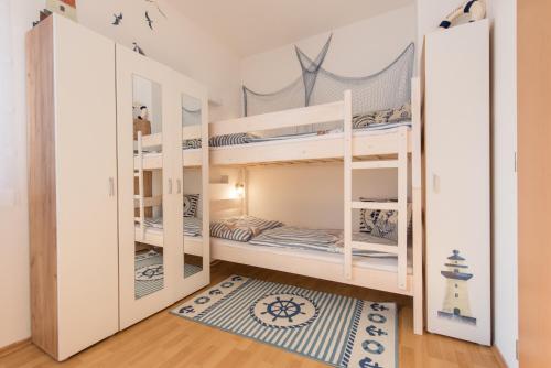 Postel nebo postele na pokoji v ubytování Apartmán Jonáš u pláže