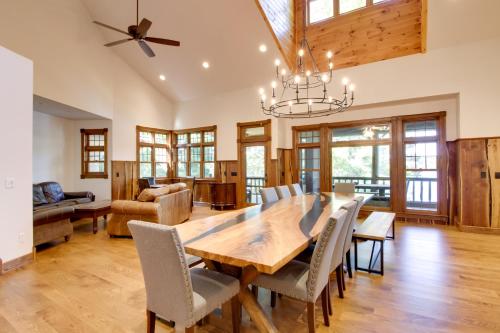 a dining room with a wooden table and chairs at Sprawling Minnesota Home with On-Site Lake Access in Lake Shore