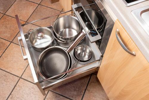 a bunch of pots and pans in a dishwasher at Chalet Rosita in Livigno