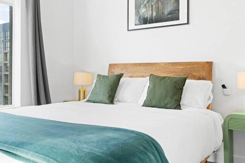 Ένα ή περισσότερα κρεβάτια σε δωμάτιο στο Spectacular Central City 2BD2BA