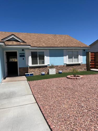 a house with a gravel driveway in front of it at Peaceful Vegas in Las Vegas