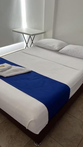 Postel nebo postele na pokoji v ubytování Hotel Puerto Azul