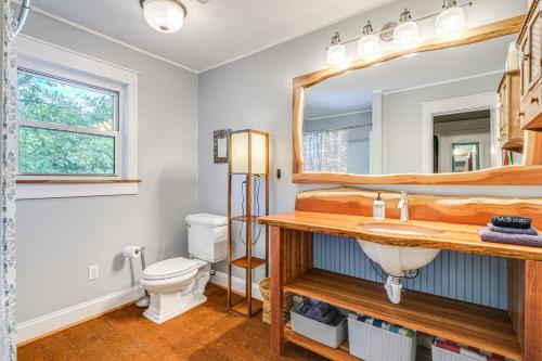 a bathroom with a sink and a mirror at Blacksburg Hideaway with Hot Tub about 5 Mi to Campus! in Blacksburg