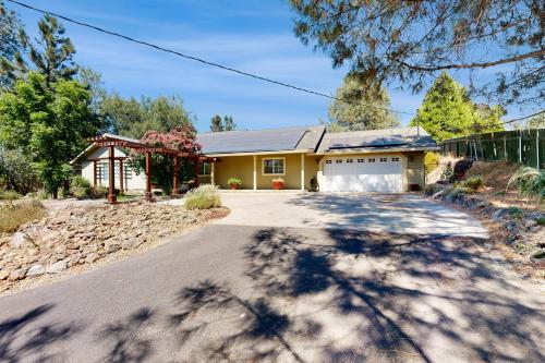 a house with a driveway in front of it at The Great Escape in Copperopolis
