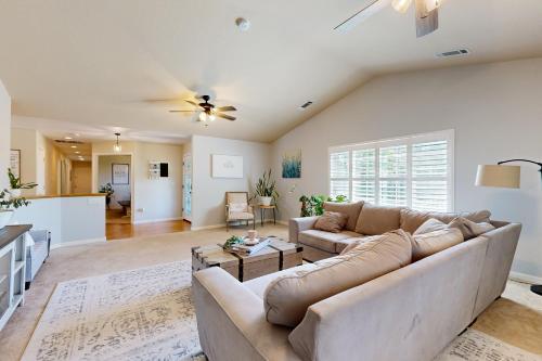 a living room with a couch and a table at The Great Escape in Copperopolis
