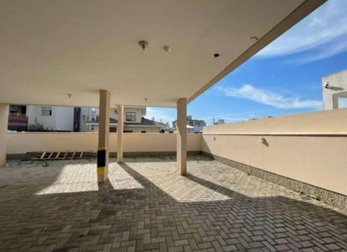 a view from the roof of a building with columns at AP completo na Praia de Palmas, SC in Governador Celso Ramos