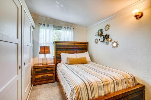 a small bedroom with a bed and a window at Walk to Buckingham Farms Peaceful Fort Myers Home in Fort Myers