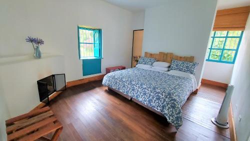 Una cama o camas en una habitación de Hacienda Tocarema