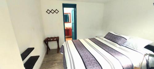 Una cama o camas en una habitación de Hacienda Tocarema