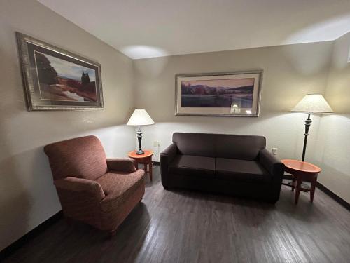 a living room with a couch and a chair at MountainView Lodge and Suites in Bozeman