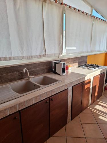 Kuchyň nebo kuchyňský kout v ubytování Casa Vacanze VILLA MELINA