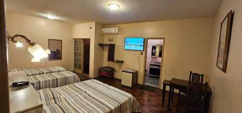 TV a/nebo společenská místnost v ubytování Hotel Colonial