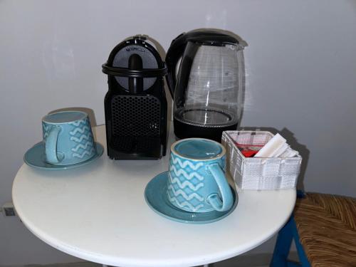 Příslušenství pro přípravu čaje a kávy v ubytování Tiburtina Suites, Roma