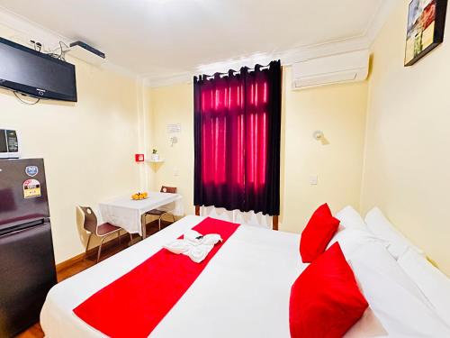 Postel nebo postele na pokoji v ubytování Harrison Motel Papatoetoe