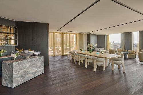 a dining room with a table and chairs at Koenigshof, a Luxury Collection Hotel, Munich in Munich