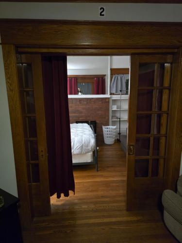 a view of a bedroom with a bed through a door at Unit 1 at Oilgate at Oakdale in Akron