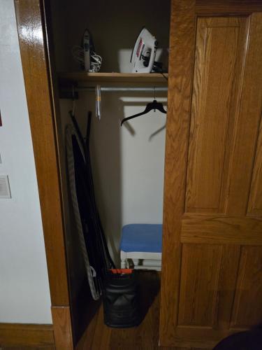 a room with a closet with a door and a bag at Unit 1 at Oilgate at Oakdale in Akron