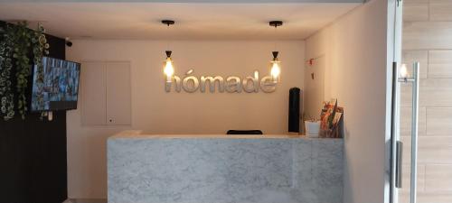 a home office with a marble counter and lights at Apartamento con increíble vista al mar in Lima