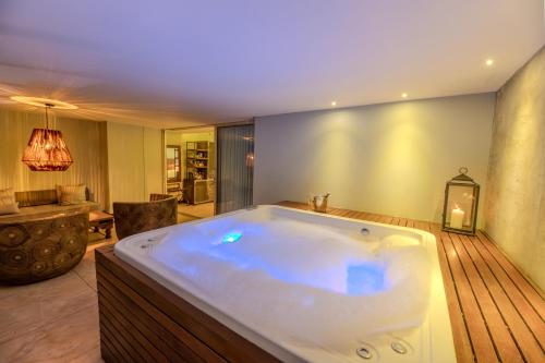 a large bathroom with a large tub in it at The Charlee Hotel in Medellín