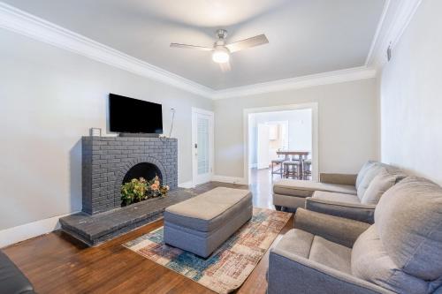 a living room with a couch and a fireplace at Luxurious 6 bedroom villa near downtown in San Antonio
