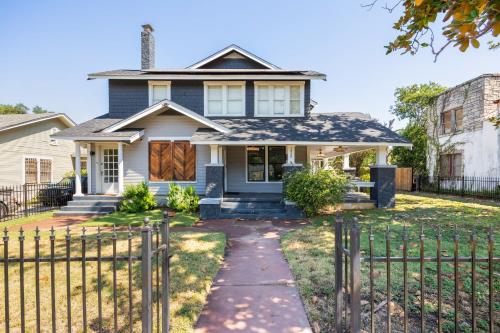 a house with a fence in front of it at Luxurious 6 bedroom villa near downtown in San Antonio
