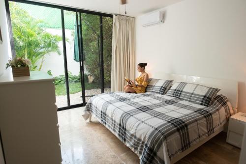 Ένα ή περισσότερα κρεβάτια σε δωμάτιο στο Tu hogar en Mérida