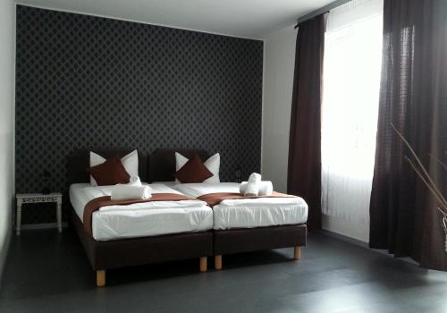 Ένα ή περισσότερα κρεβάτια σε δωμάτιο στο Lieth-Hotel-Grünreich