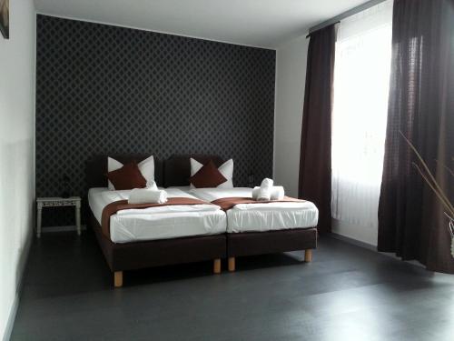 Ένα ή περισσότερα κρεβάτια σε δωμάτιο στο Lieth-Hotel-Grünreich