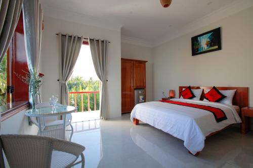 Voodi või voodid majutusasutuse Coconut Garden Homestay toas