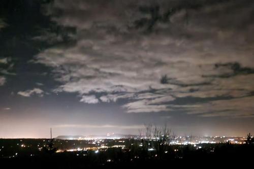a view of a city at night at Bracken Cottage in Ballyeaston