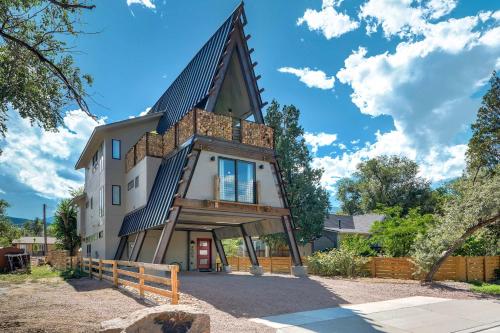 an image of a house with a gambrel roof at A-Frame Wonders Hot Tub w Mountain Views in Colorado Springs
