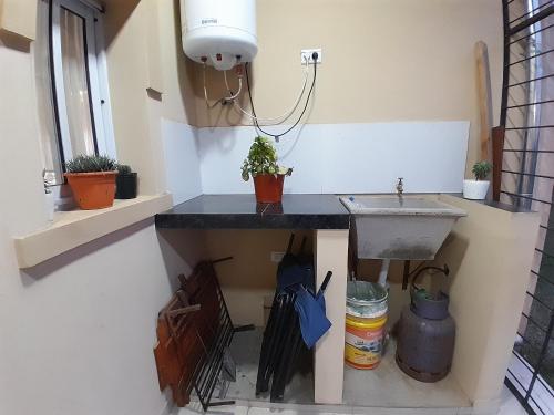 a kitchen with a sink and a window at "La Armonía" alquiler por día in Mercedes