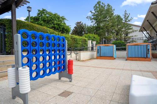 a set of blue and white dominoes on a sidewalk at 4BR Disney Family Townhouse Resort in Orlando - with Resort Pool, Gym, Games, & Jacuzzi in Orlando