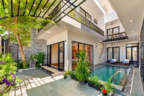 an image of a house with a swimming pool at U Maison by Class6 in Hoi An