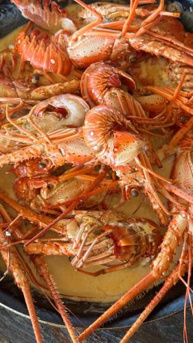 a pile of crabs sitting on top of a table at El Embrujo Tintipan in Tintipan Island