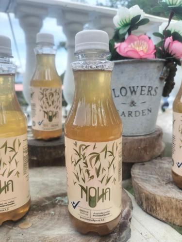 a group of bottles of honey on a table at La Cabaña Eco Hotel in Suaita