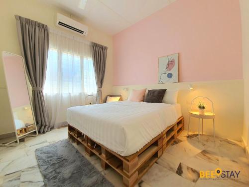 a bedroom with a large bed in a room at Jenjarom No 32 Modern Cozy Homestay for 4 Pax by Beestay in Jenjarum