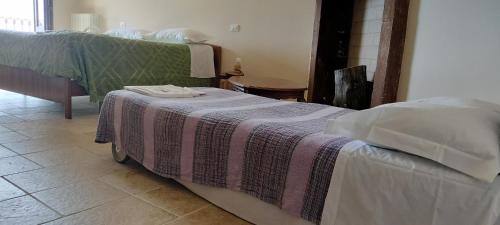Postel nebo postele na pokoji v ubytování Il sogno DIMORA STORICA