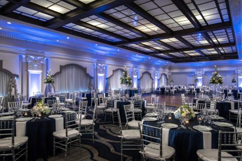 a banquet hall with tables and chairs in a ballroom at The Notary Hotel, Philadelphia, Autograph Collection by Marriott in Philadelphia