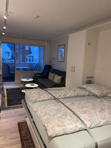 Ένα ή περισσότερα κρεβάτια σε δωμάτιο στο Haus Seelord Wohnung 38