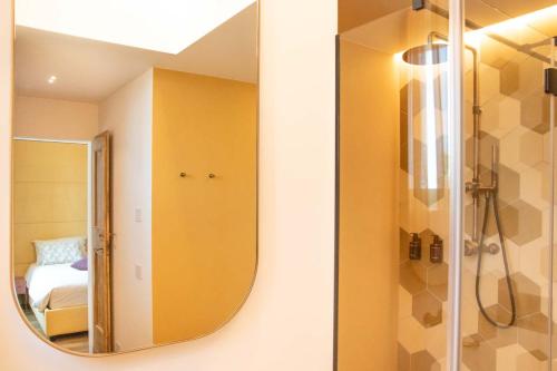 a bathroom with a mirror and a shower at Casale Riversa in Poncarale