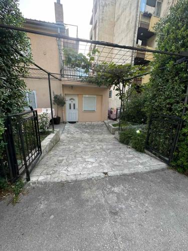 an entrance to a building with a black gate at Apartments Amigo in Kotor