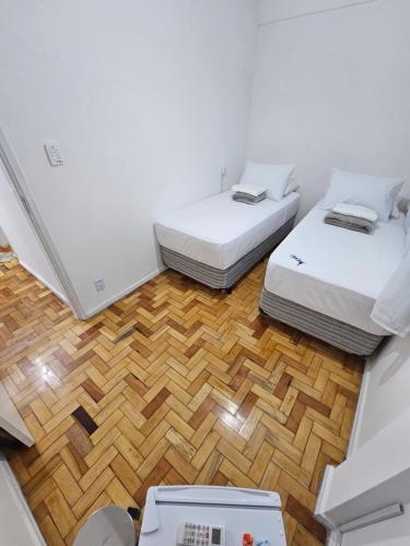 Ένα ή περισσότερα κρεβάτια σε δωμάτιο στο Quarto Privativo em Condominio