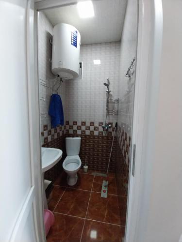 a bathroom with a toilet and a sink at Sweet studio with all amenities in Batumi