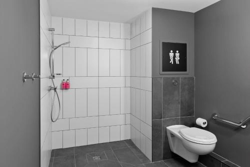 a bathroom with a shower and a toilet in it at Moxy La Ciotat in La Ciotat