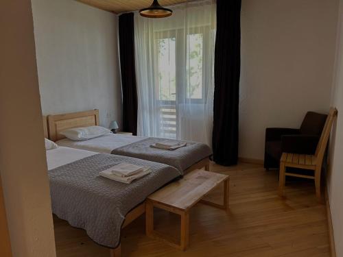 Postel nebo postele na pokoji v ubytování Beko’s garden Inn