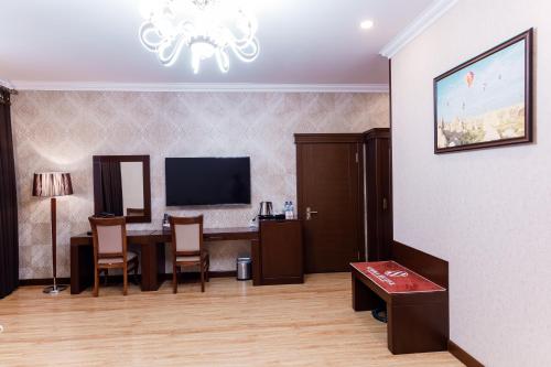 TV a/nebo společenská místnost v ubytování Simma Hotel Spa & Waterpark