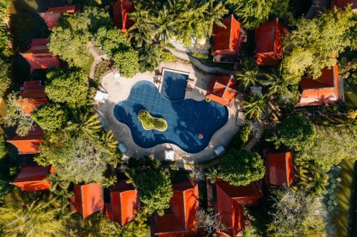 an aerial view of a house with a swimming pool at Ma Doo Bua Stay - SHA Extra Plus in Thalang