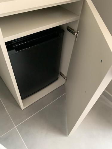 a cabinet with a dishwasher in a kitchen at B&B The Princess accanto all'Aeroporto di Salerno-Costa D'Amalfi in Bellizzi